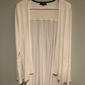 Open white sweater by Jeanne Pierre.